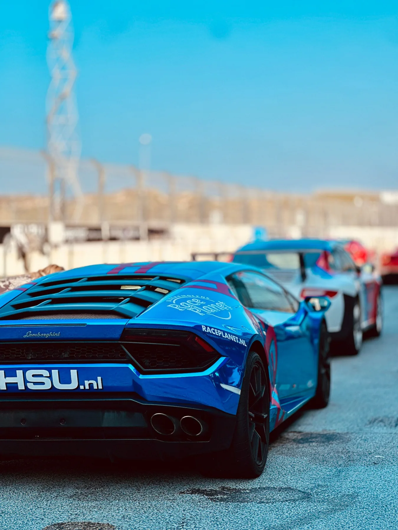 Sports cars lined up on a race track