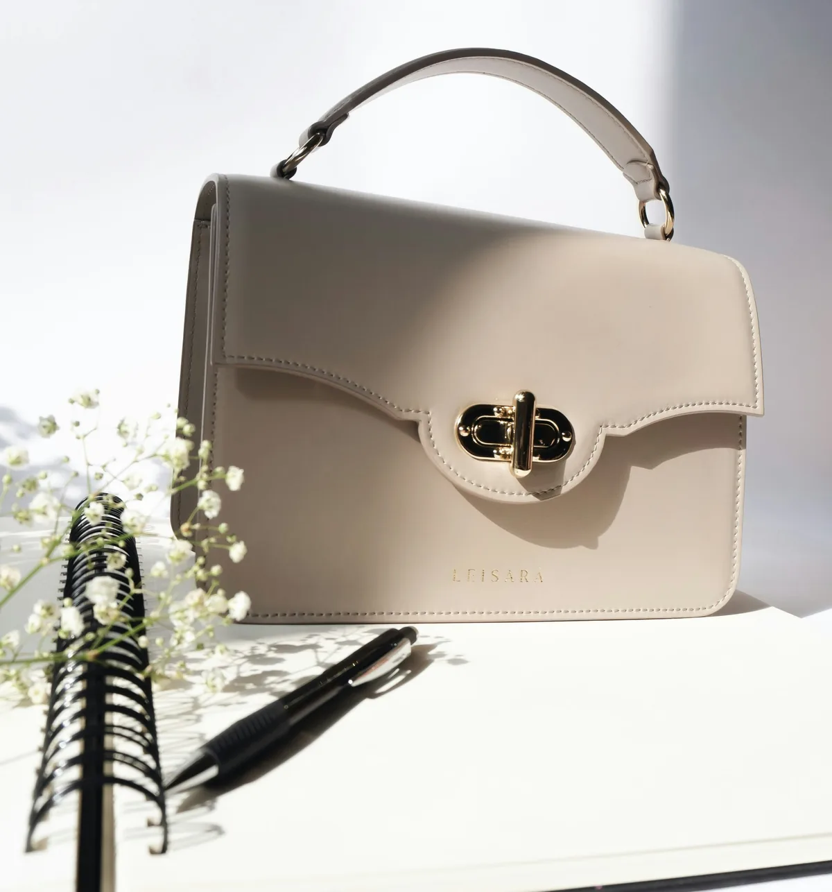 A cream leather handbag