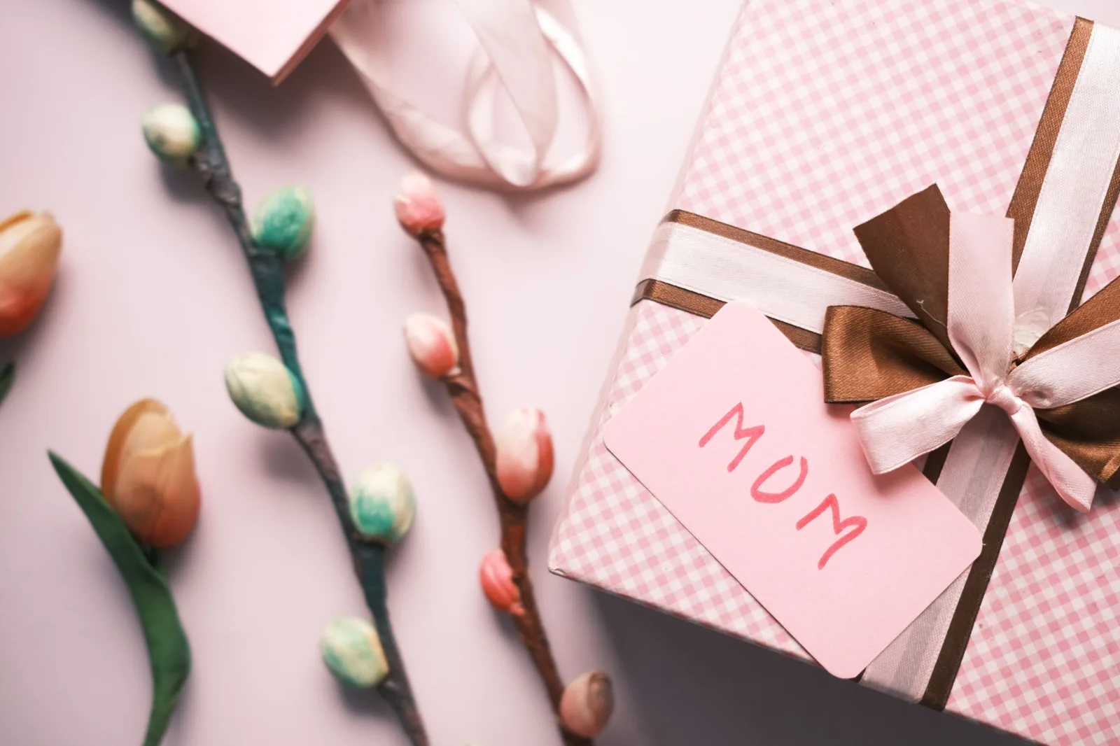 Pink wrapped gift with a handwritten Mum tag