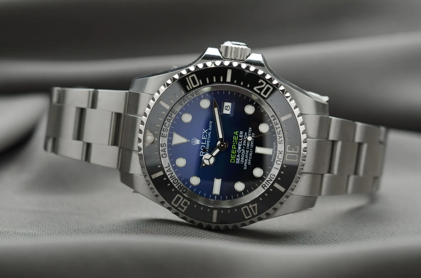 A stainless steel wristwatch with a metal link bracelet