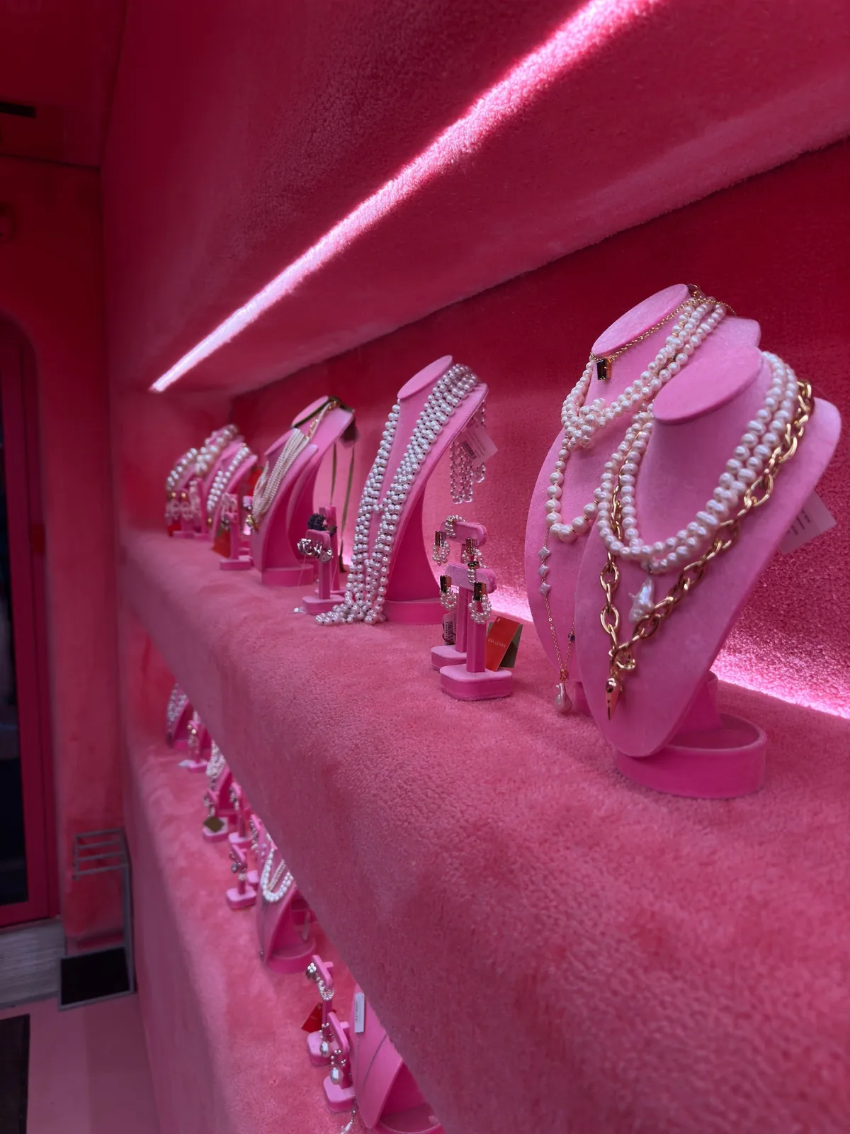 Pearl necklaces and earrings arranged for display