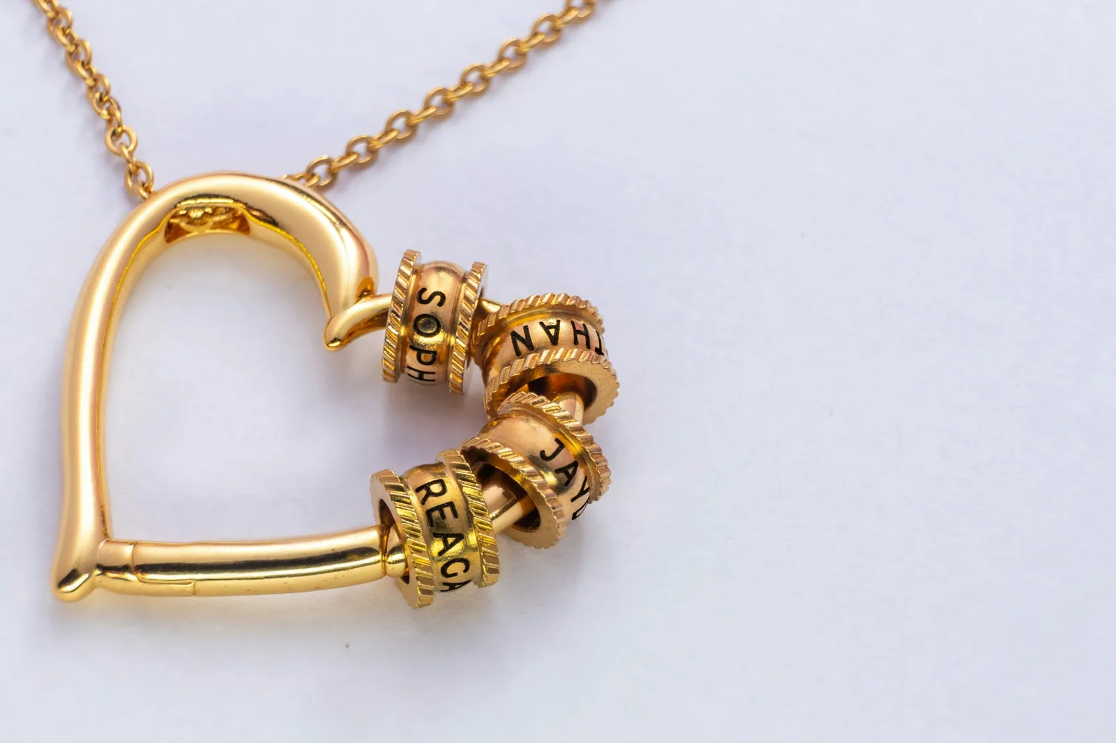 A gold-coloured heart necklace. The photograph does not confirm the metal purity.