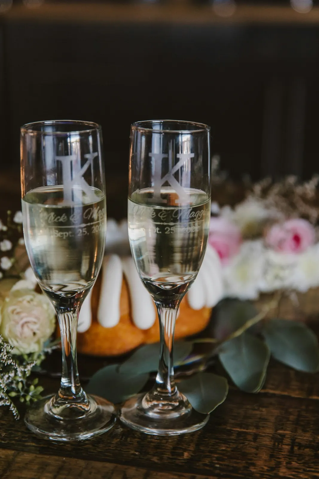 Two engraved champagne flutes arranged for a celebration