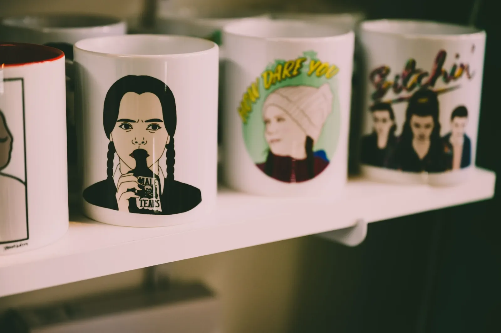 Ceramic mugs decorated with illustrated character designs