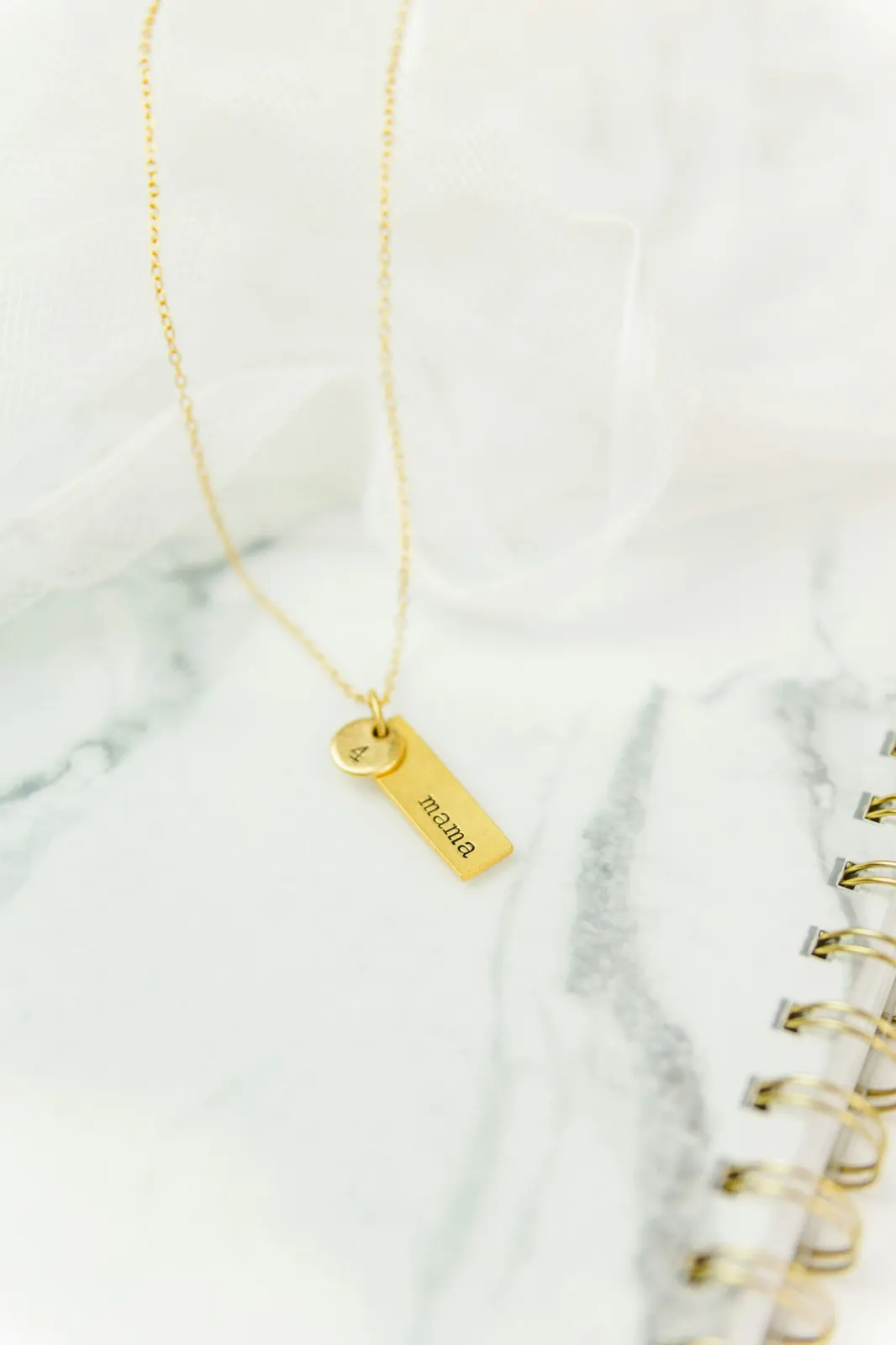 Gold necklace with a personalised mama pendant